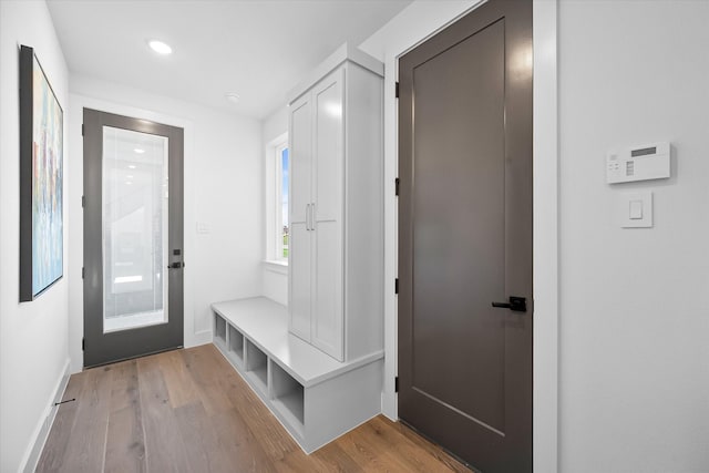 mudroom featuring baseboards, wood finished floors, and recessed lighting