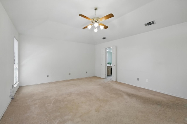 unfurnished room with light carpet, a ceiling fan, visible vents, and a healthy amount of sunlight