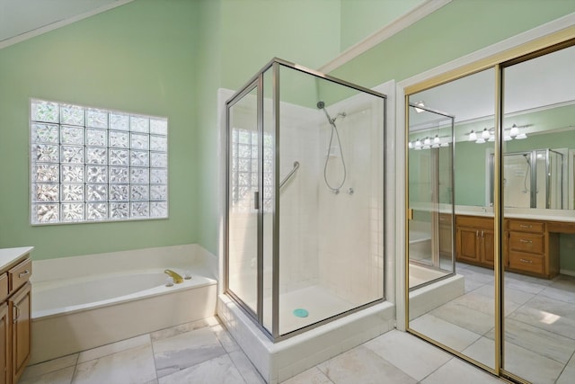 full bathroom featuring a garden tub, vanity, and a shower stall