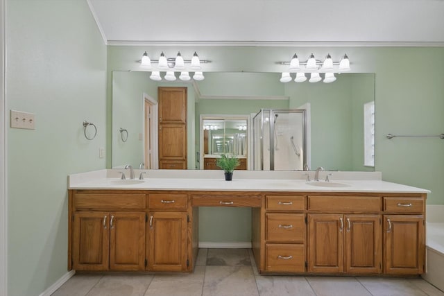 bathroom with double vanity, crown molding, a stall shower, and a sink