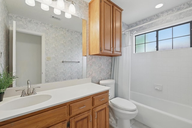 full bath featuring wallpapered walls, visible vents, toilet, vanity, and shower / tub combo