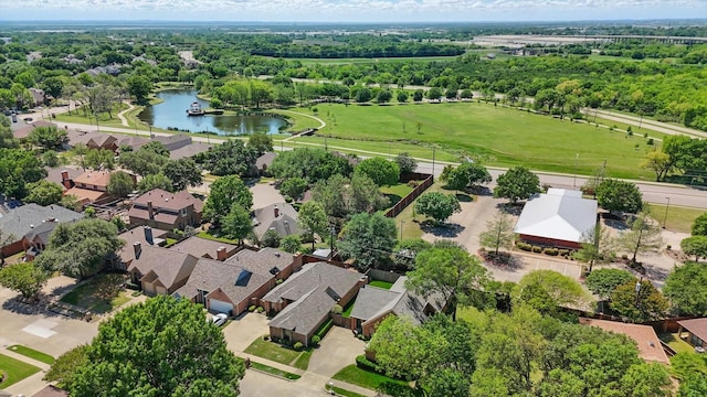 drone / aerial view featuring a residential view and a water view