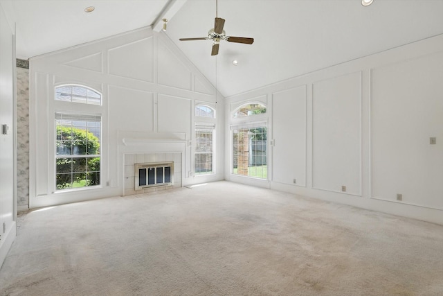 unfurnished living room with high vaulted ceiling, a decorative wall, carpet flooring, and beamed ceiling