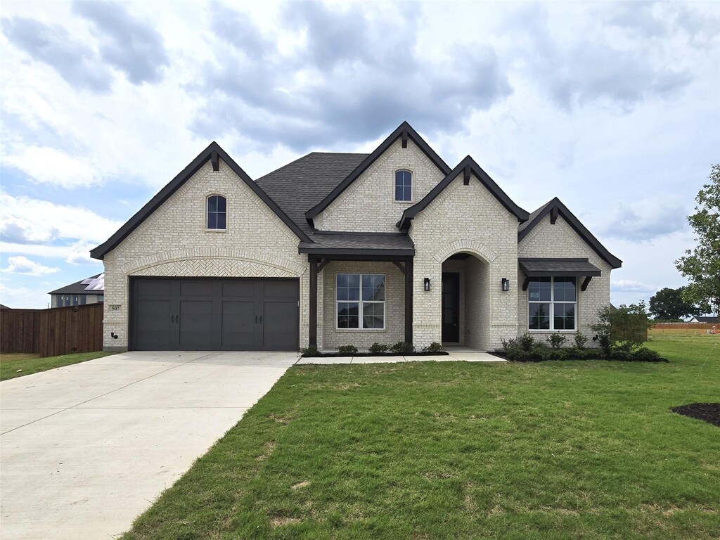 507 Alto Ave, Forney, TX 75126 - french country inspired facade featuring brick siding and driveway