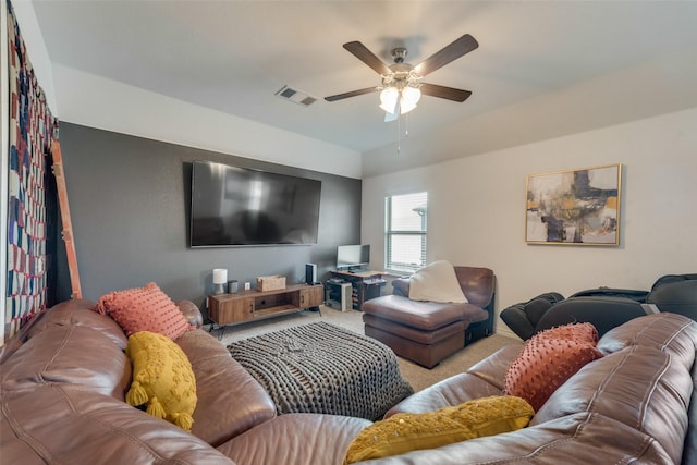 carpeted living area featuring a ceiling fan and visible vents