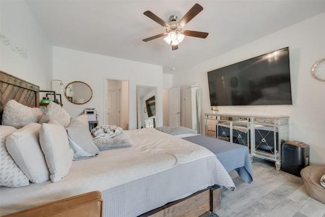 bedroom with a ceiling fan and wood finished floors