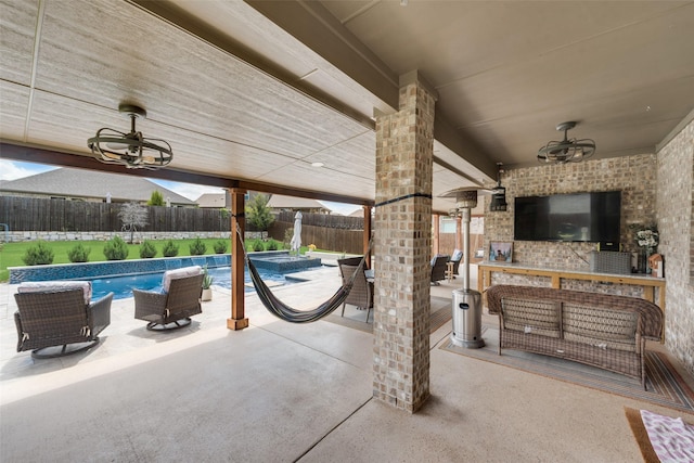 view of patio with an outdoor living space, a fenced backyard, a fenced in pool, and outdoor dining space