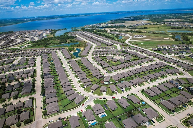 bird's eye view with a water view and a residential view