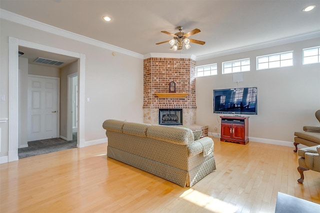 11632 Virginia Way Ct, Fort Worth, TX 76008 - living area featuring plenty of natural light, wood finished floors, a fireplace, and ceiling fan