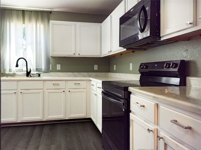 920 Kendall Dr, Arlington, TX 76001 - kitchen with black appliances, a sink, light countertops, and white cabinetry