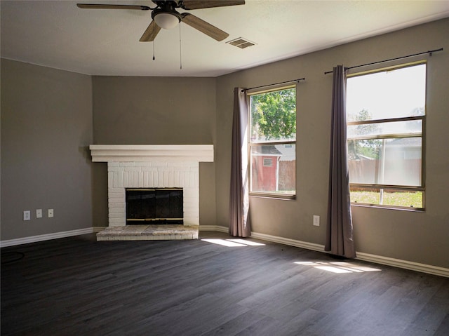 920 Kendall Dr, Arlington, TX 76001 - unfurnished living room with wood finished floors, a fireplace, ceiling fan, and baseboards
