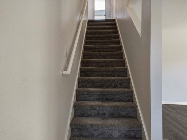 920 Kendall Dr, Arlington, TX 76001 - stairs with baseboards and wood finished floors