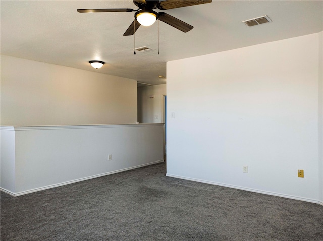 920 Kendall Dr, Arlington, TX 76001 - unfurnished room featuring ceiling fan, dark colored carpet, and baseboards