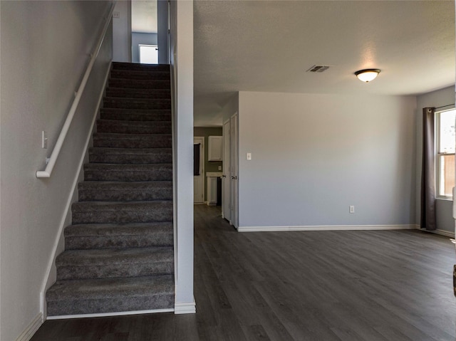 920 Kendall Dr, Arlington, TX 76001 - stairs with wood finished floors and baseboards