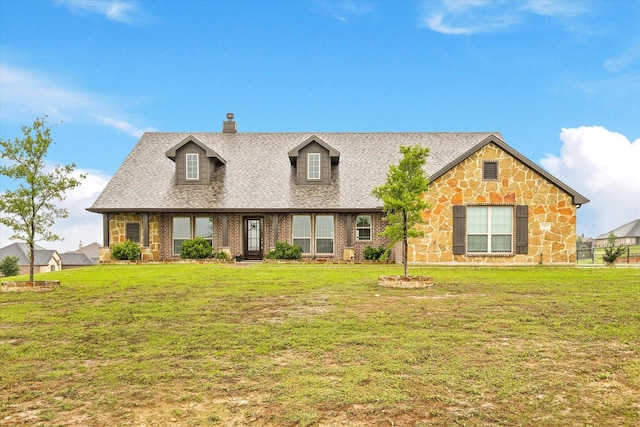 7401 Green Mesa Rd, Ponder, TX 76259 - cape cod home with a shingled roof, a front lawn, and brick siding
