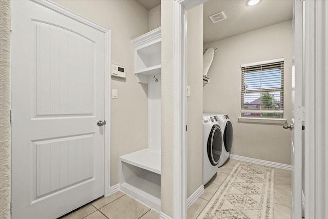 7401 Green Mesa Rd, Ponder, TX 76259 - clothes washing area with washer and dryer, light tile patterned floors, and baseboards