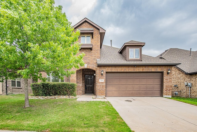 traditional-style house with brick siding, a front lawn, concrete driveway, an attached garage, and a shingled roof