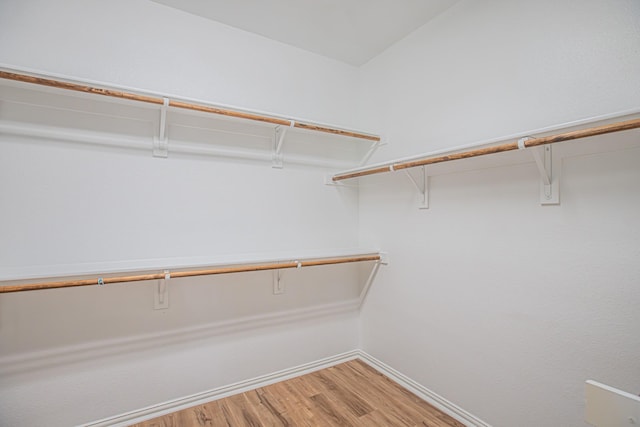 spacious closet with light wood-style floors