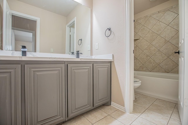 bathroom with vanity, tile patterned flooring, shower / bathing tub combination, and toilet