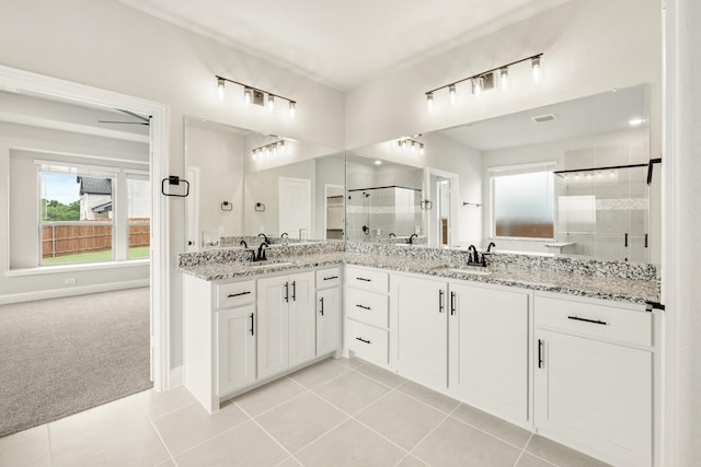 2708 Creekhollow Ct, Denton, TX 76226 - bathroom featuring a stall shower, double vanity, and tile patterned flooring