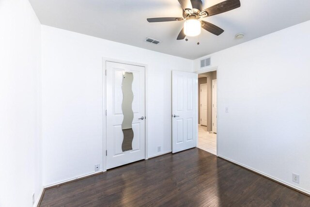15905 Avenel Way, Fort Worth, TX 76177 - unfurnished bedroom with dark wood finished floors, ceiling fan, and baseboards