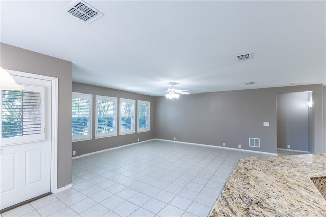 15905 Avenel Way, Fort Worth, TX 76177 - empty room with light tile patterned flooring, ceiling fan, and baseboards