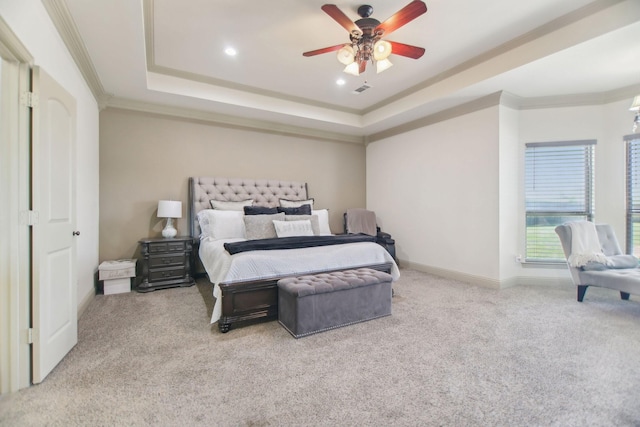 bedroom with carpet, a raised ceiling, crown molding, and baseboards