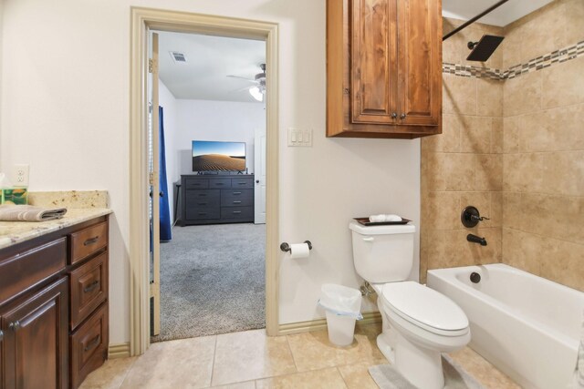 bathroom featuring ceiling fan, toilet, visible vents, baseboards, and tile patterned flooring