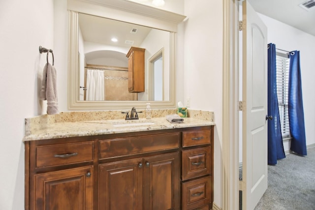 bathroom with visible vents and vanity