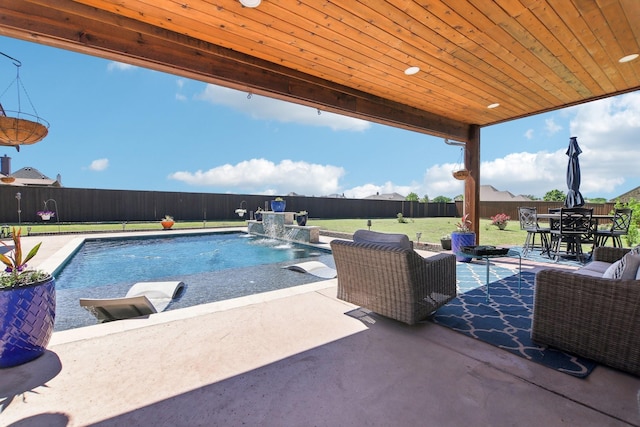 view of pool featuring a fenced in pool, a patio area, a lawn, and a fenced backyard
