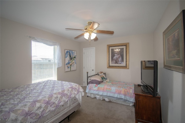 carpeted bedroom with a ceiling fan