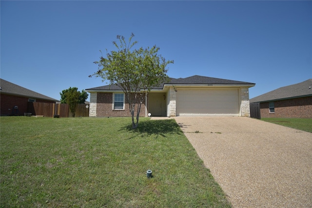single story home featuring fence, concrete driveway, an attached garage, stone siding, and a front yard