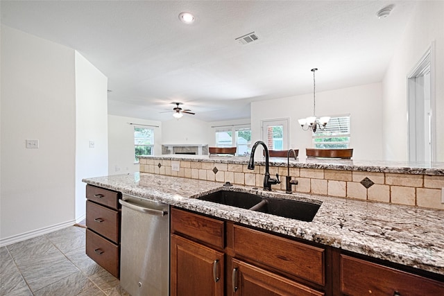 351 Peachtree Ln, Princeton, TX 75407 - kitchen featuring light stone countertops, a sink, visible vents, dishwasher, and ceiling fan with notable chandelier