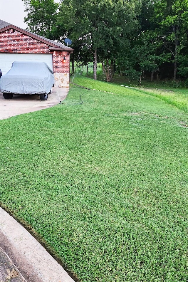 351 Peachtree Ln, Princeton, TX 75407 - back of property featuring a lawn, brick siding, a chimney, and a patio area