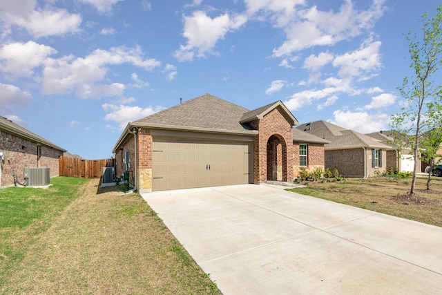 1607 Grand Villa St, Princeton, TX 75407 - single story home with driveway, fence, brick siding, an attached garage, and a front yard