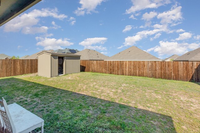 1607 Grand Villa St, Princeton, TX 75407 - view of yard featuring a fenced backyard, an outbuilding, and a storage unit