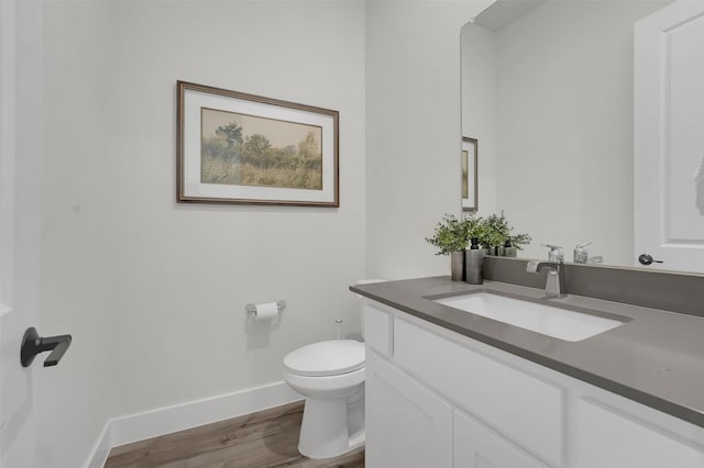 4330 Silver Spur Dr, Prosper, TX 75078 - bathroom with wood finished floors, toilet, baseboards, and vanity