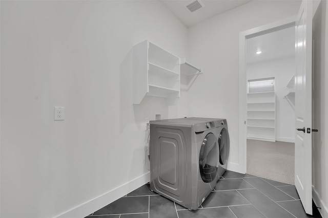 4330 Silver Spur Dr, Prosper, TX 75078 - laundry room with separate washer and dryer, baseboards, and dark tile patterned flooring