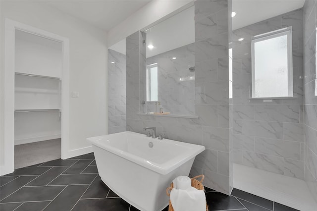 4330 Silver Spur Dr, Prosper, TX 75078 - bathroom featuring a walk in shower, a freestanding tub, tile patterned floors, and a spacious closet