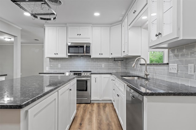 kitchen featuring white cabinets, a sink, and appliances with stainless steel finishes