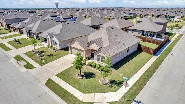 616 Stampede Ln, Princeton, TX 75407 - ranch-style home with a garage, driveway, stone siding, and a front lawn