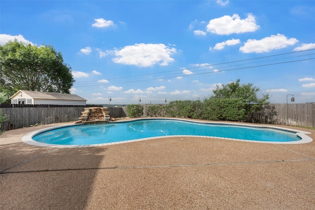 view of pool featuring a fenced backyard, a patio area, and a fenced in pool