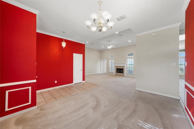 unfurnished living room featuring carpet, visible vents, baseboards, and ornamental molding