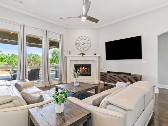 2908 Ballater Ct, The Colony, TX 75056 - living area with dark wood-type flooring, a fireplace with flush hearth, ceiling fan, crown molding, and baseboards
