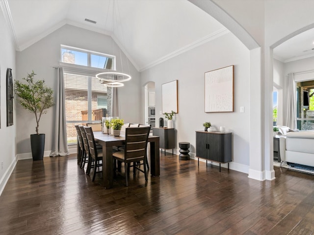dining room featuring visible vents, baseboards, dark wood-style floors, a chandelier, and vaulted ceiling