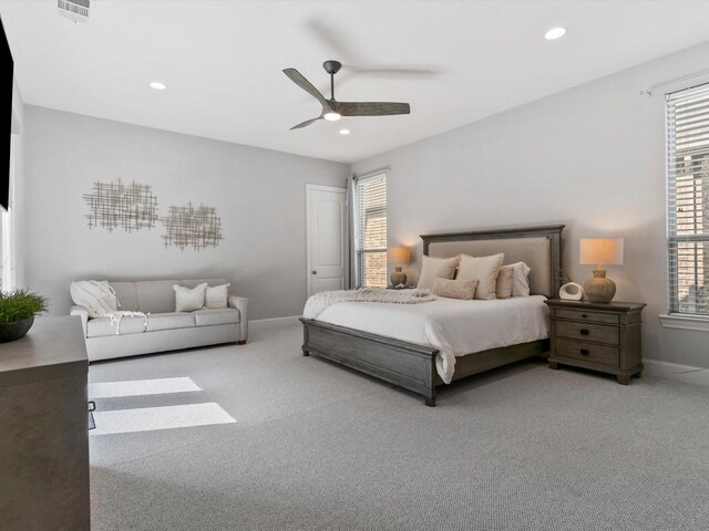 carpeted bedroom with visible vents, refrigerator, access to exterior, recessed lighting, and bar area
