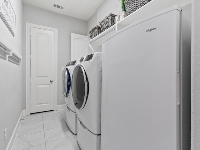 2908 Ballater Ct, The Colony, TX 75056 - laundry area with washing machine and dryer and baseboards
