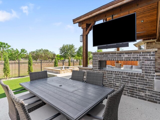 view of patio featuring an outdoor living space with a fireplace, a gazebo, ceiling fan, a fenced in pool, and a fenced backyard