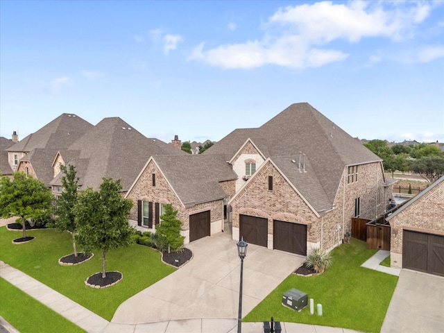 2908 Ballater Ct, The Colony, TX 75056 - french country inspired facade with brick siding, roof with shingles, stone siding, and a garage