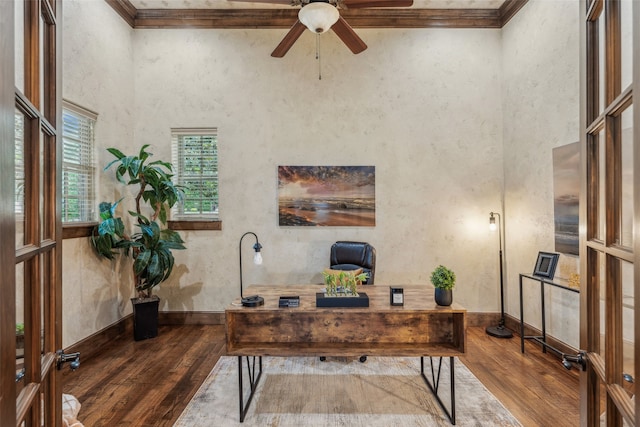 office space featuring wood-type flooring, a ceiling fan, and crown molding